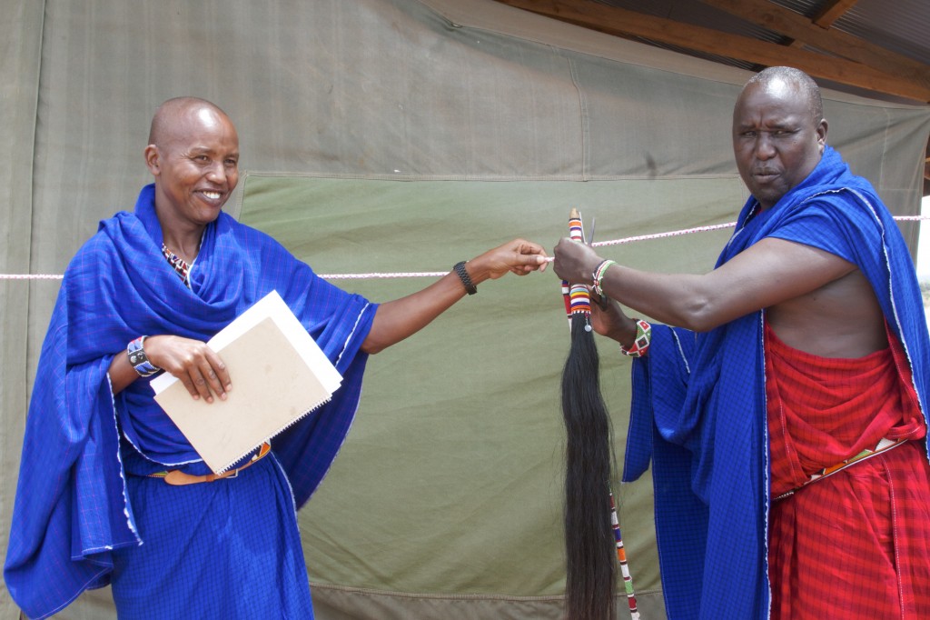 Chief Leturesh cuts the ribbon and officially declares the camp open